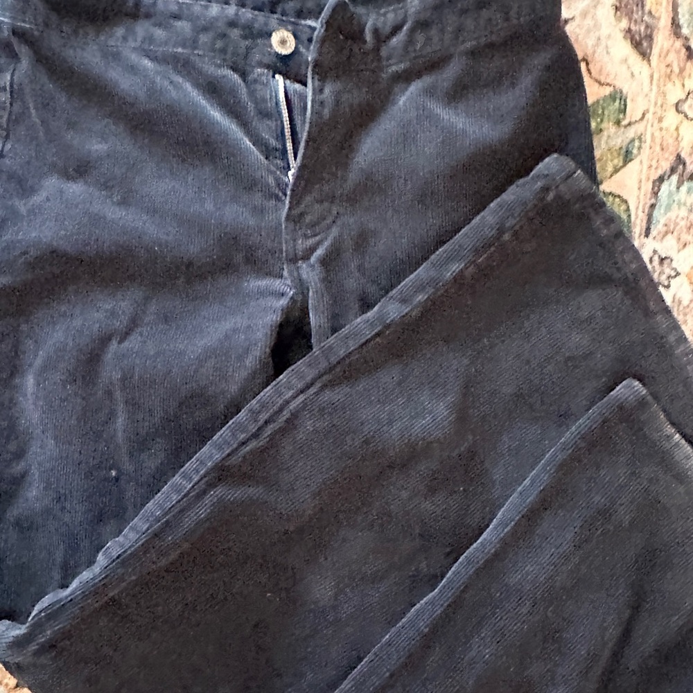 Black corduroy, low rise jeans with slight flare
